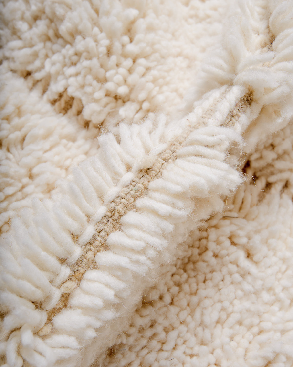 Close up of cream wool Beniourain rug.