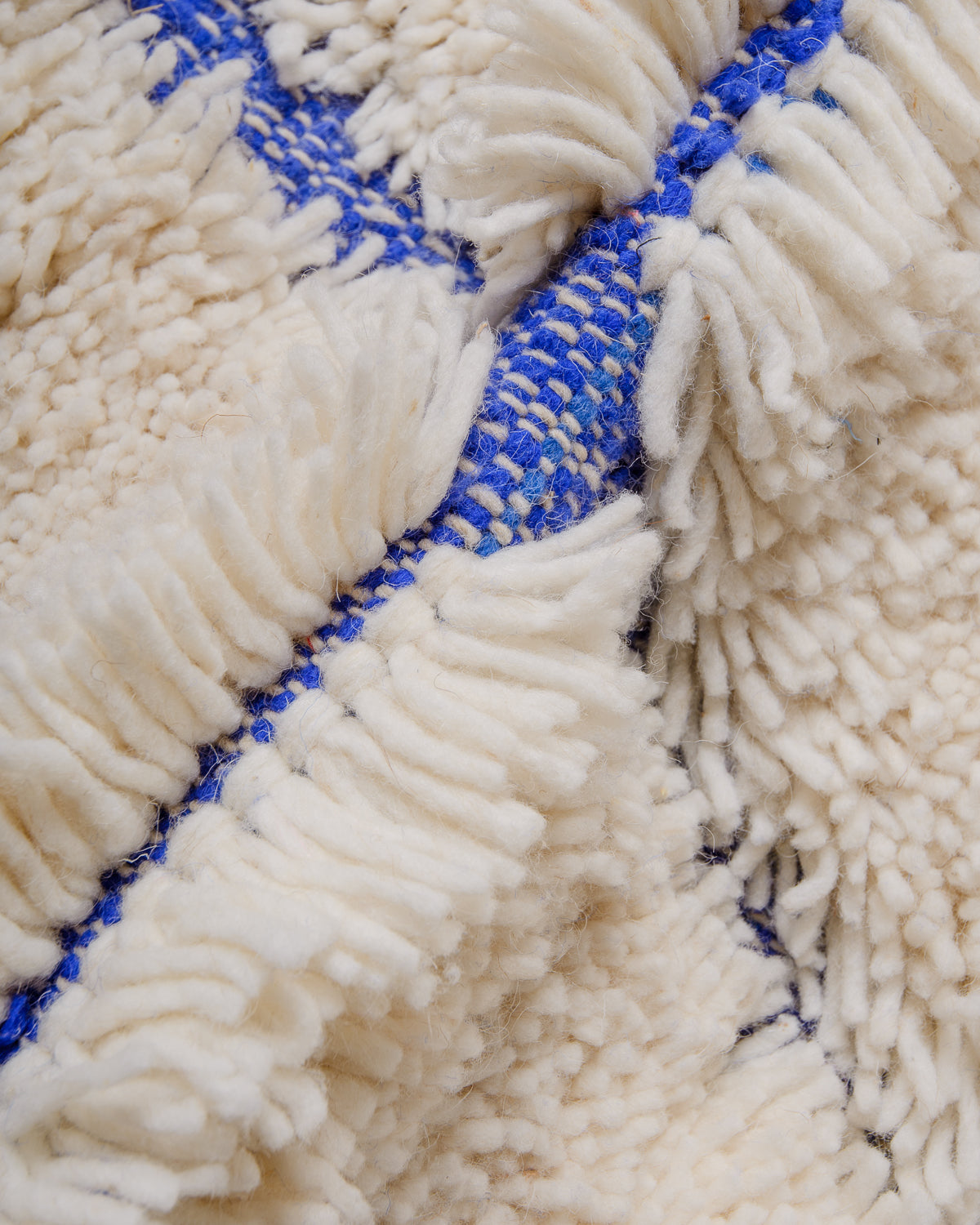 Modern, designer, handcrafted Berber rug from Morocco. Beniourain carpet with beautiful colours and patterns and fluffy wool texture.