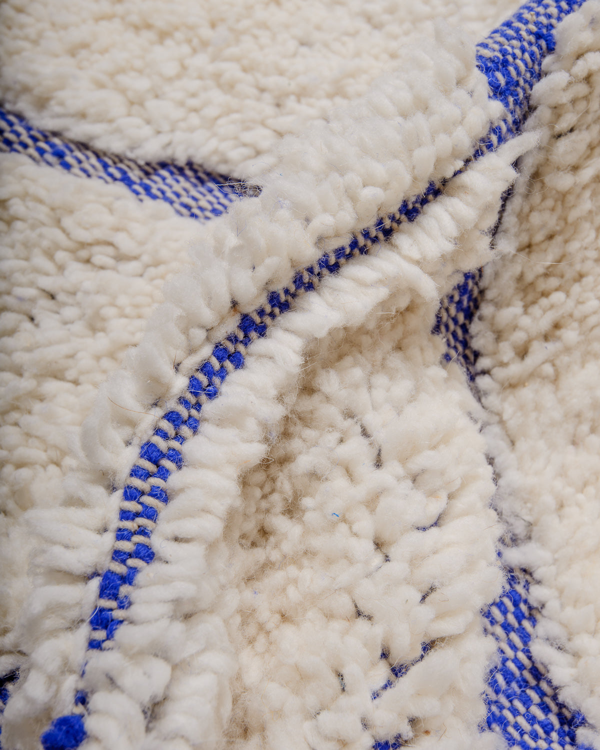 Modern, designer, handcrafted Berber rug from Morocco. Beniourain carpet with beautiful colours and patterns and fluffy wool texture.