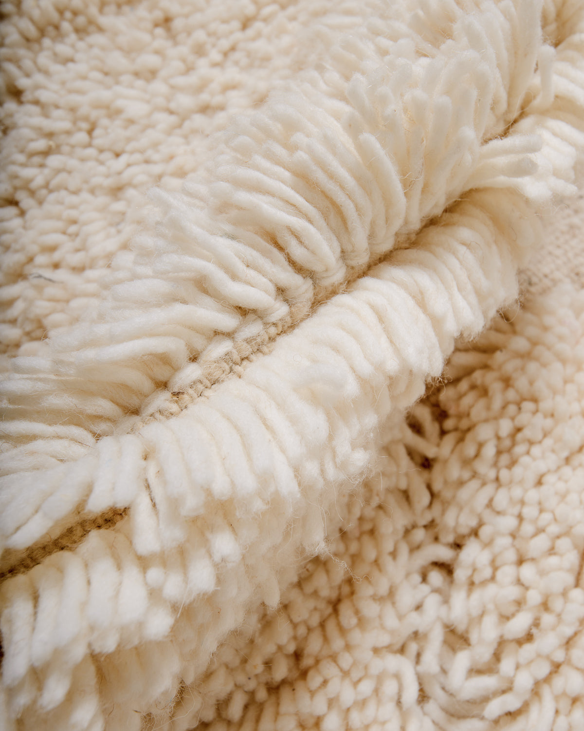 Modern, designer, handcrafted Berber rug from Morocco. Beniourain carpet with beautiful colours and patterns and fluffy wool texture.