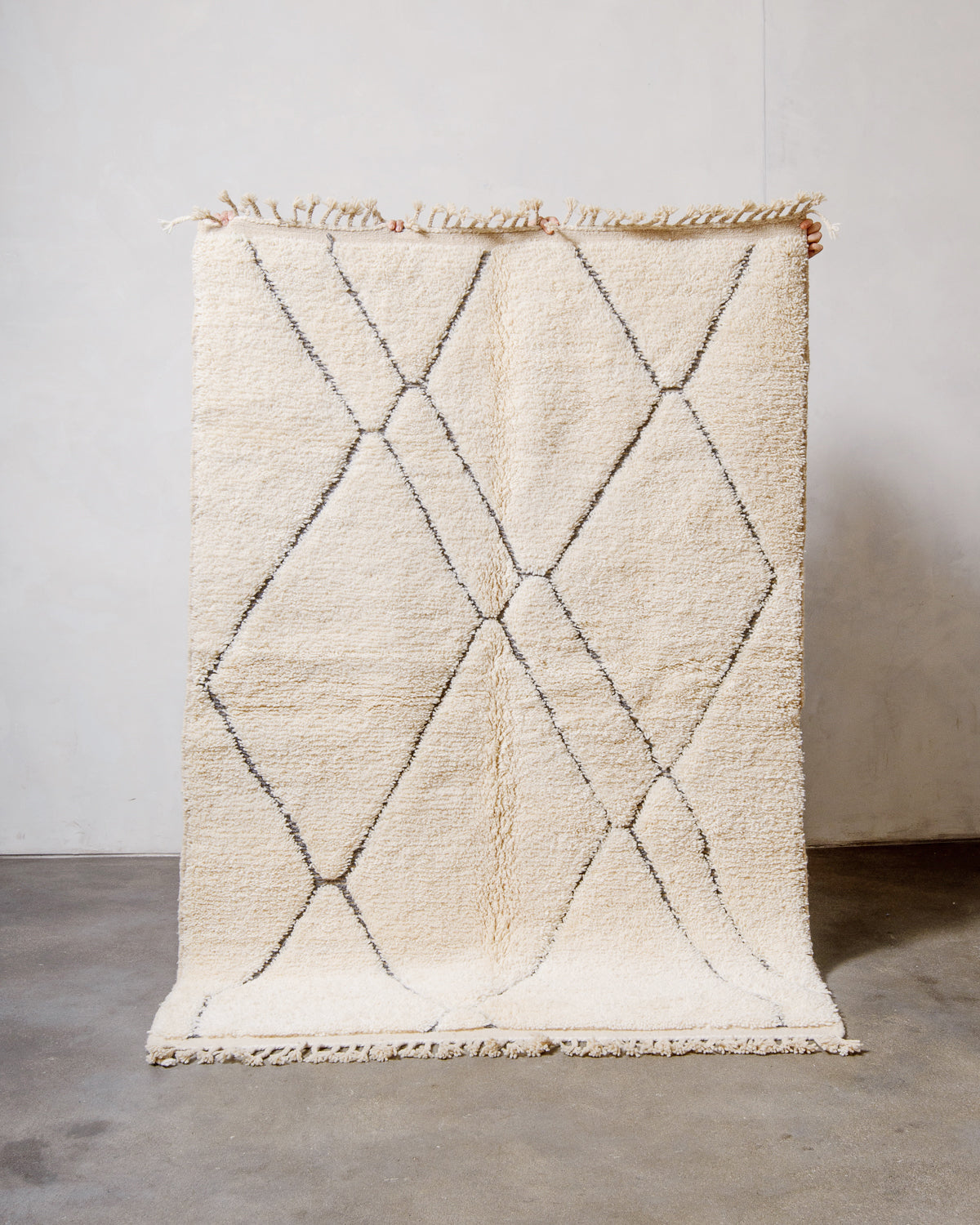 Modern, designer, handcrafted Berber rug from Morocco. Beniourain carpet with minimalist design, natural wool pile and a fluffy texture.