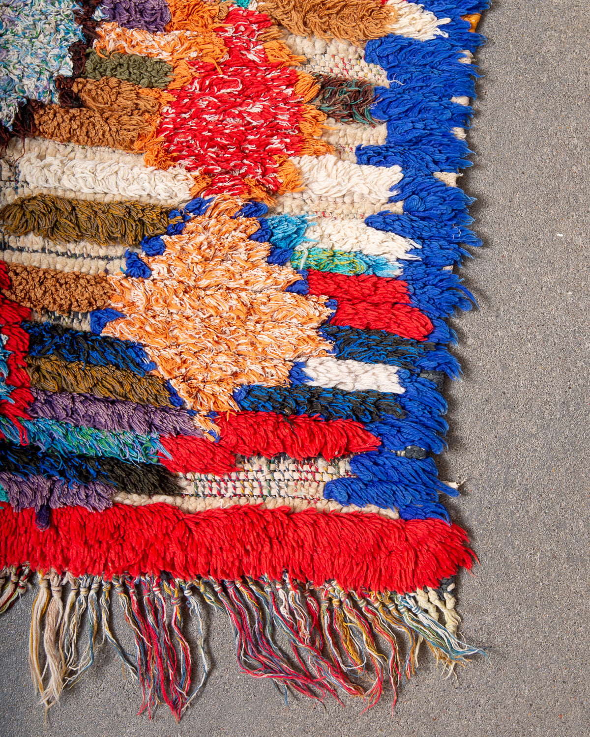 Modern designer vintage handcrafted Berber rug from Morocco. Boucherouite runner rug with beautiful colors and patterns.