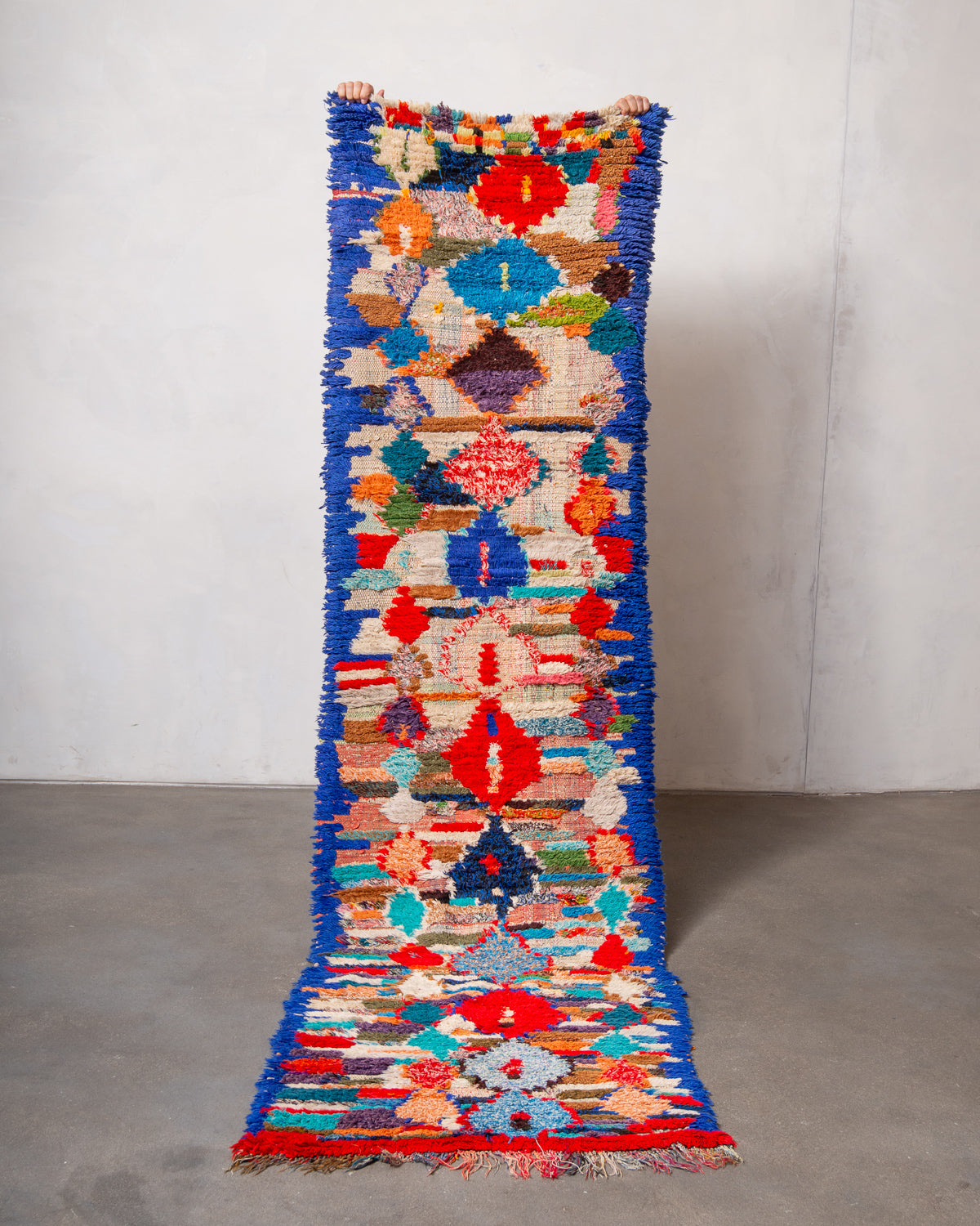 Modern designer vintage handcrafted Berber rug from Morocco. Boucherouite runner rug with beautiful colors and patterns.