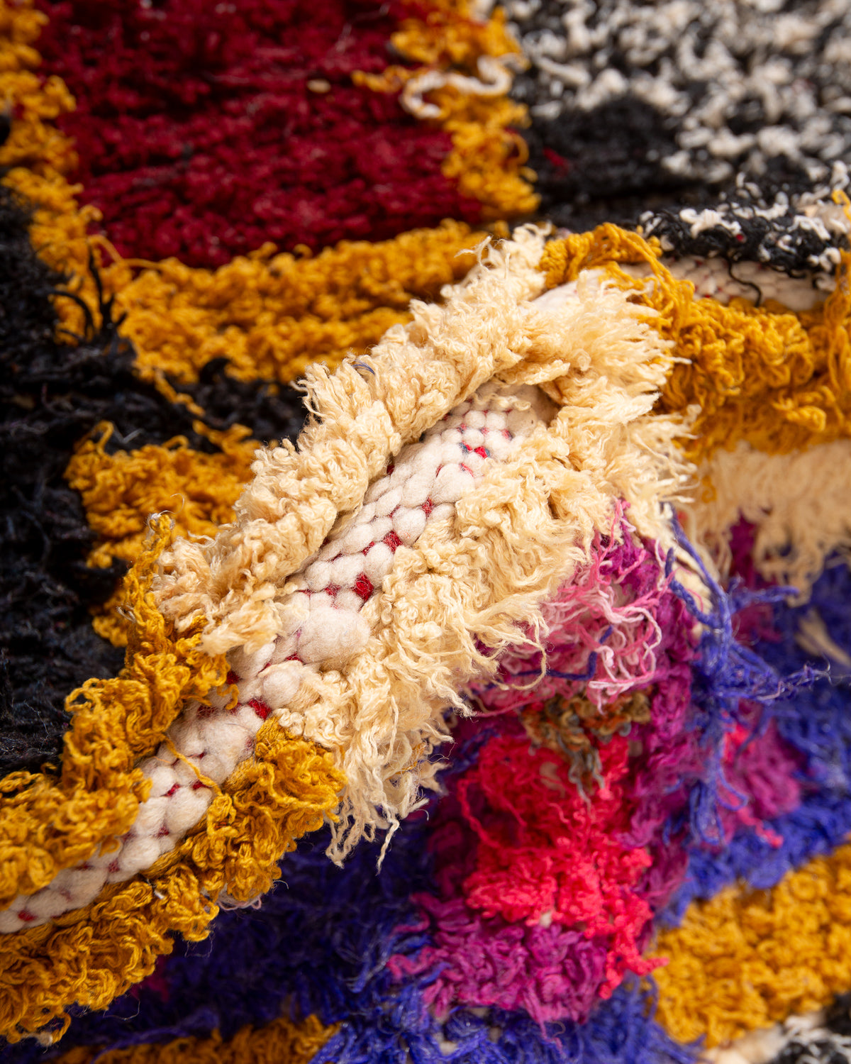 Modern designer vintage handcrafted Berber rug from Morocco. Boucherouite runner rug with beautiful colors and patterns.