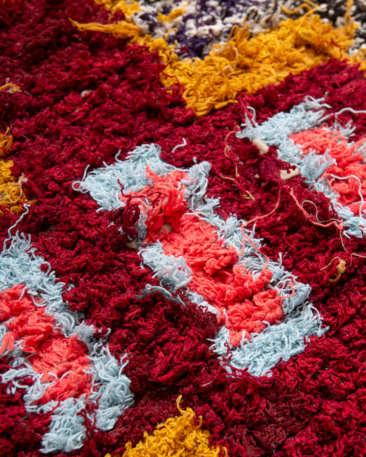 Modern designer vintage handcrafted Berber rug from Morocco. Boucherouite runner rug with beautiful colors and patterns.