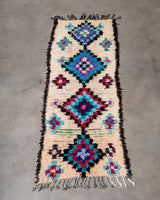 Modern designer vintage handcrafted Berber rug from Morocco. Boucherouite runner rug with beautiful colors and patterns.