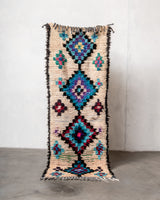 Modern designer vintage handcrafted Berber rug from Morocco. Boucherouite runner rug with beautiful colors and patterns.