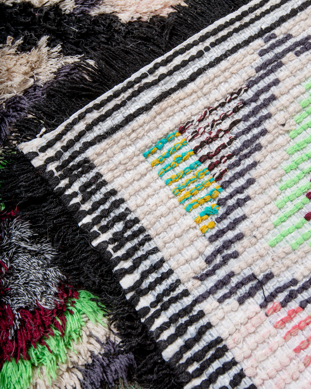 Modern designer vintage handcrafted Berber rug from Morocco. Boucherouite runner rug with beautiful colors and patterns.