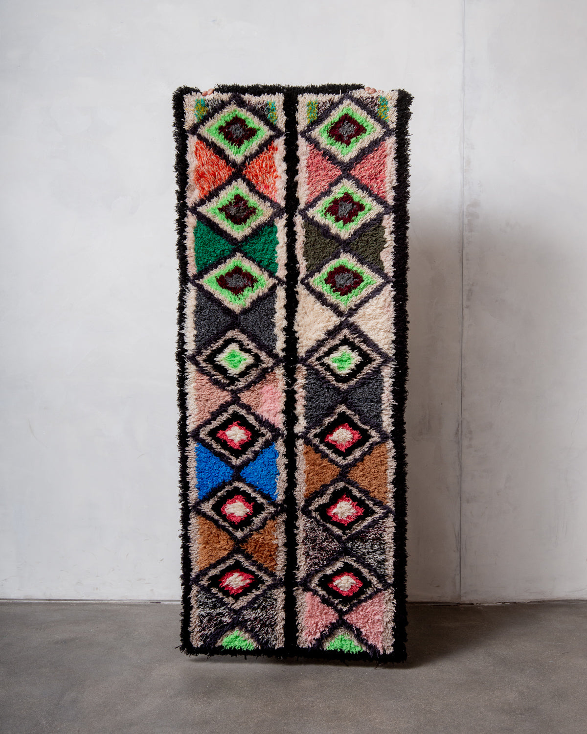 Modern designer vintage handcrafted Berber rug from Morocco. Boucherouite runner rug with beautiful colors and patterns.