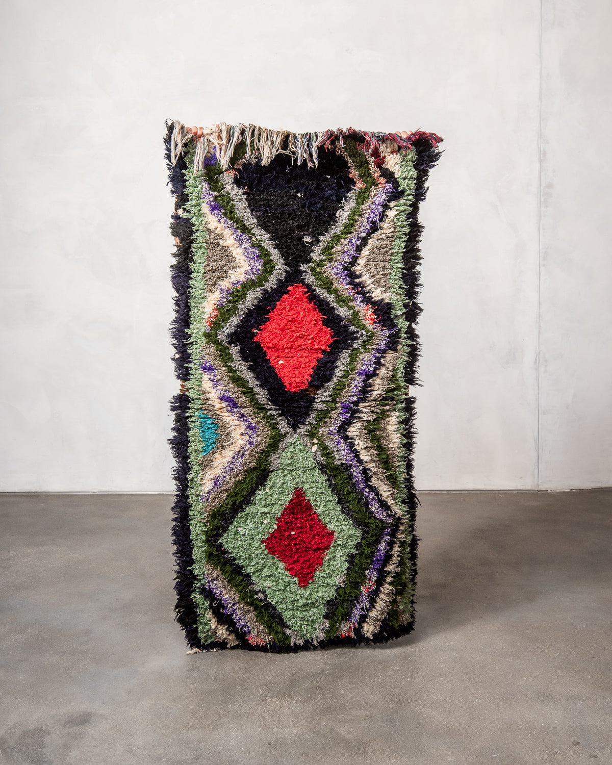 Modern designer vintage handcrafted Berber rug from Morocco. Boucherouite runner rug with beautiful colors and patterns.