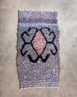 Modern designer vintage handcrafted Berber rug from Morocco. Boucherouite runner rug with beautiful colors and patterns.