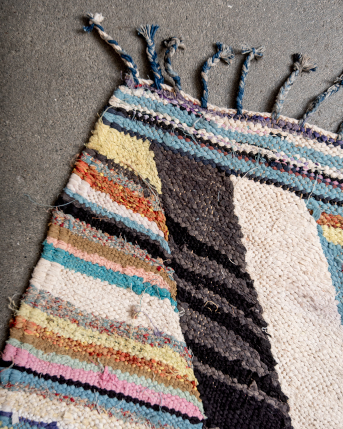 Modern designer vintage handcrafted Berber rug from Morocco. Boucherouite runner rug with beautiful colors and patterns.