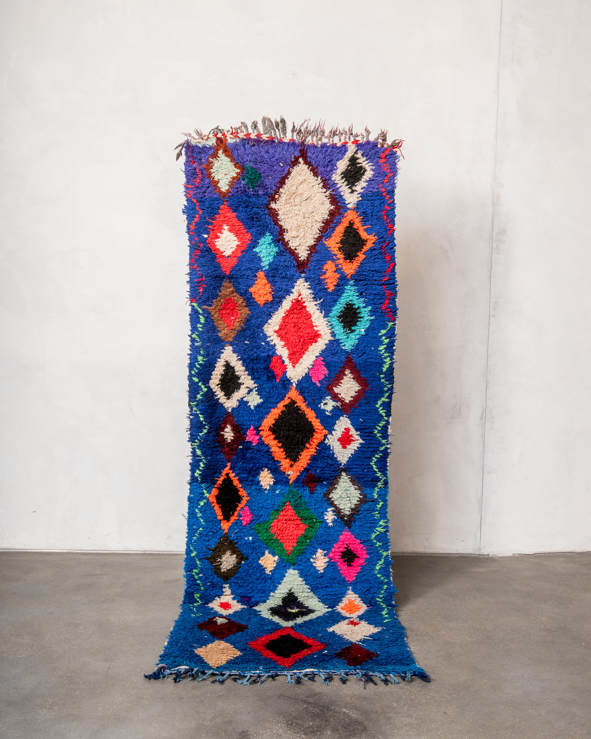 Modern designer vintage handcrafted Berber rug from Morocco. Boucherouite runner rug with beautiful colors and patterns.
