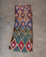 Modern designer vintage handcrafted Berber rug from Morocco. Boucherouite runner rug with beautiful colors and patterns.
