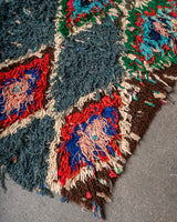 Modern designer vintage handcrafted Berber rug from Morocco. Boucherouite runner rug with beautiful colors and patterns.