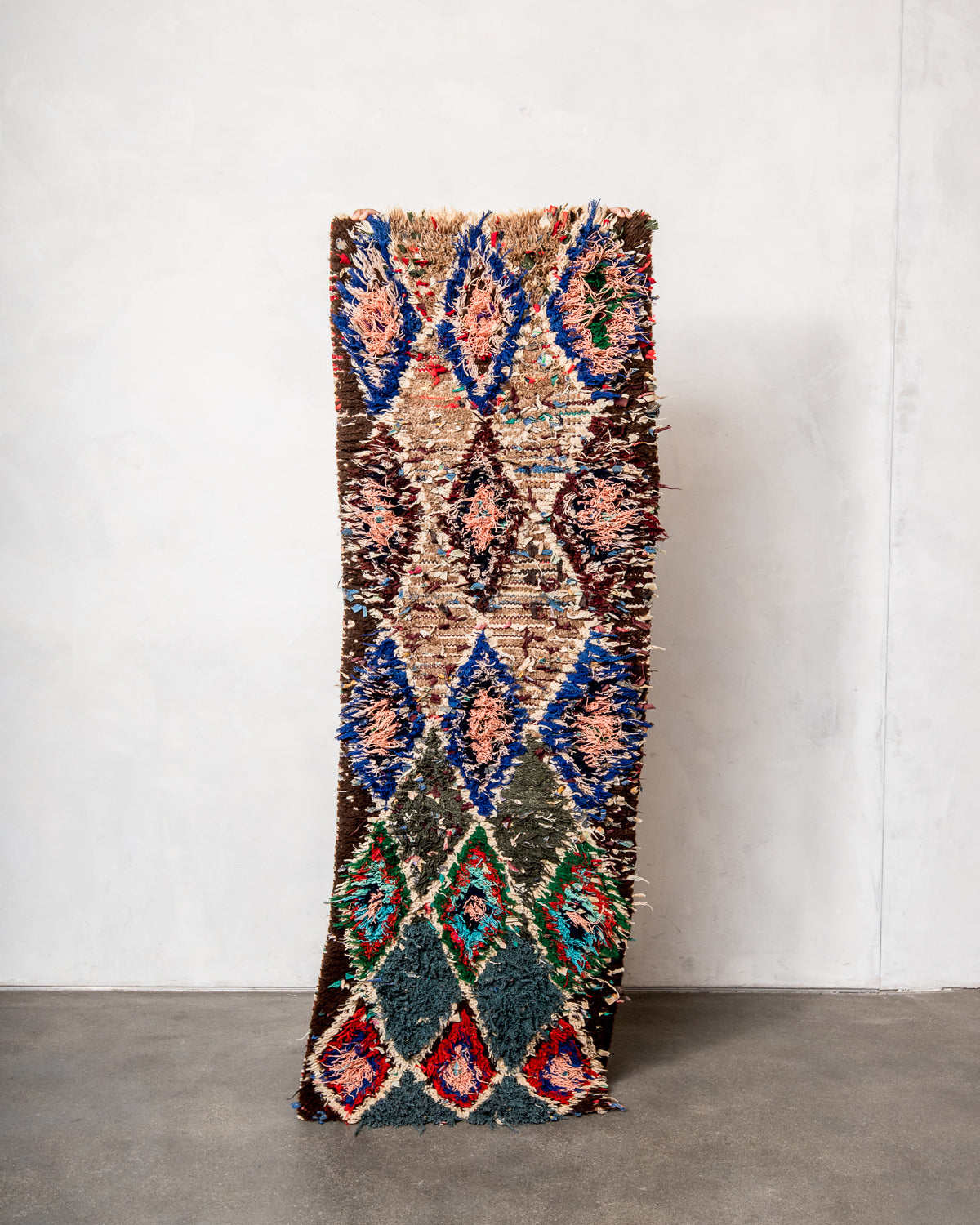 Modern designer vintage handcrafted Berber rug from Morocco. Boucherouite runner rug with beautiful colors and patterns.