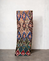 Modern designer vintage handcrafted Berber rug from Morocco. Boucherouite runner rug with beautiful colors and patterns.
