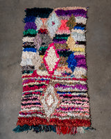 Modern designer vintage handcrafted Berber rug from Morocco. Boucherouite runner rug with beautiful colors and patterns.