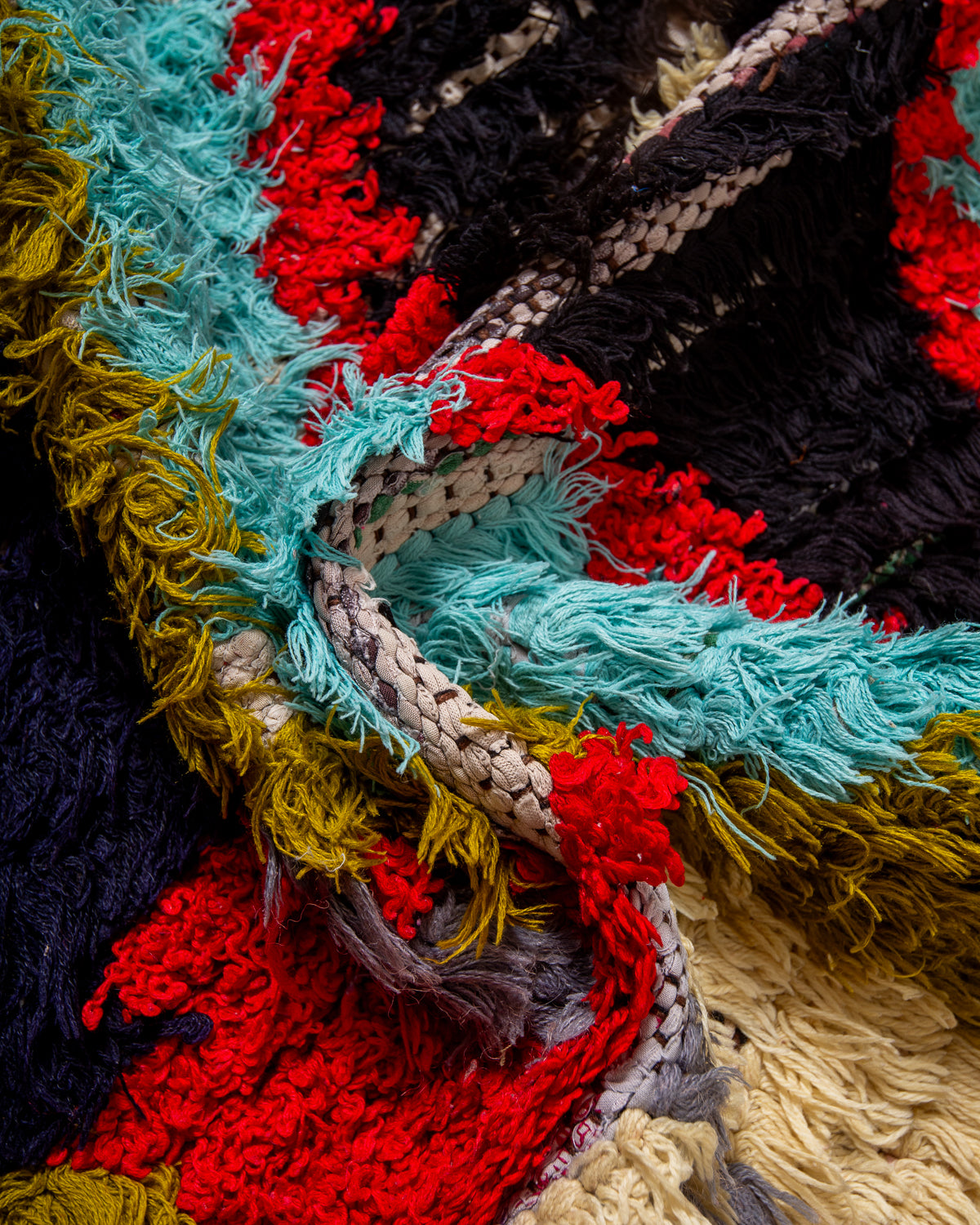 Modern designer vintage handcrafted Berber rug from Morocco. Boucherouite runner rug with beautiful colors and patterns.