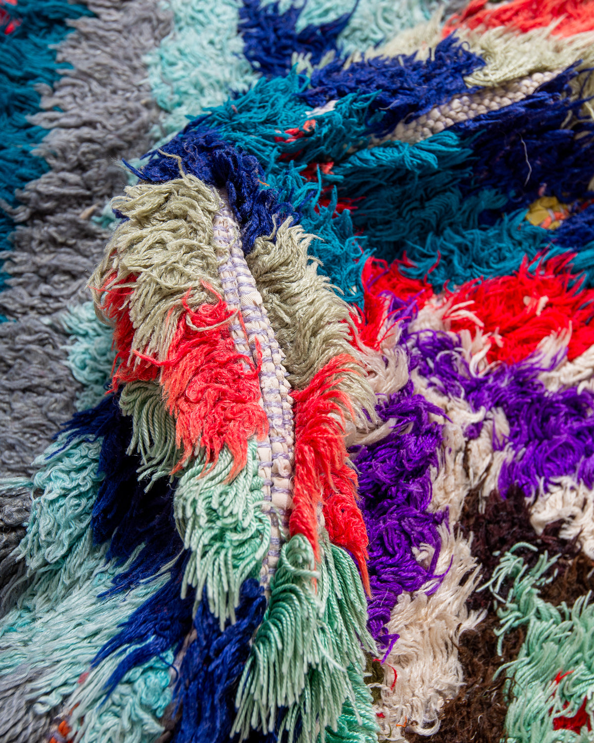 Modern designer vintage handcrafted Berber rug from Morocco. Boucherouite runner rug with beautiful colors and patterns.