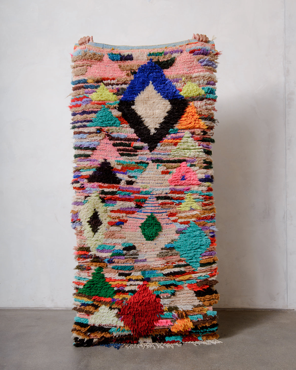 Modern designer vintage handcrafted Berber rug from Morocco. Boucherouite runner rug with beautiful colors and patterns.