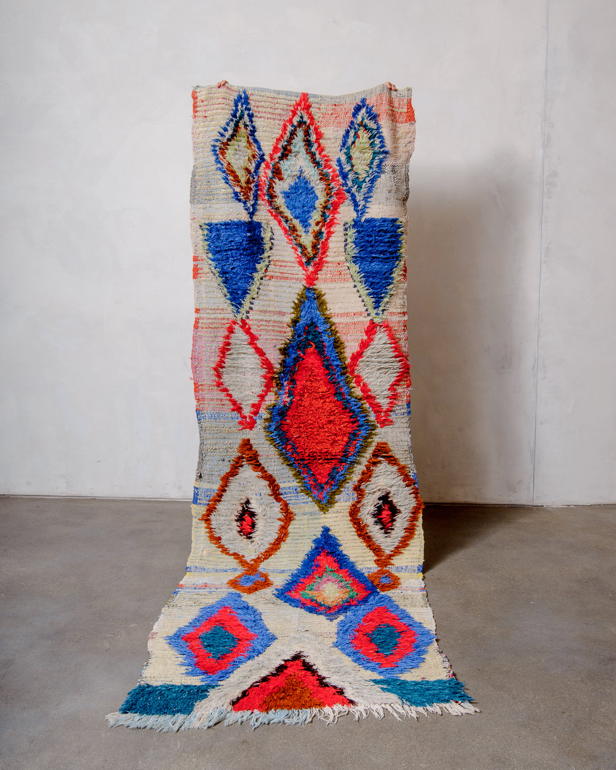 Modern designer vintage handcrafted Berber rug from Morocco. Boucherouite runner rug with beautiful colors and patterns.