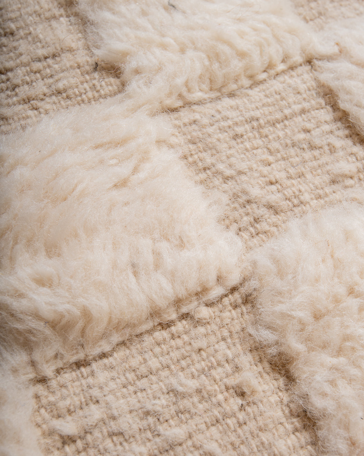 Modern, designer, handcrafted Berber rug from Morocco. Beniourain carpet with minimalist design, natural wool pile and a fluffy texture.