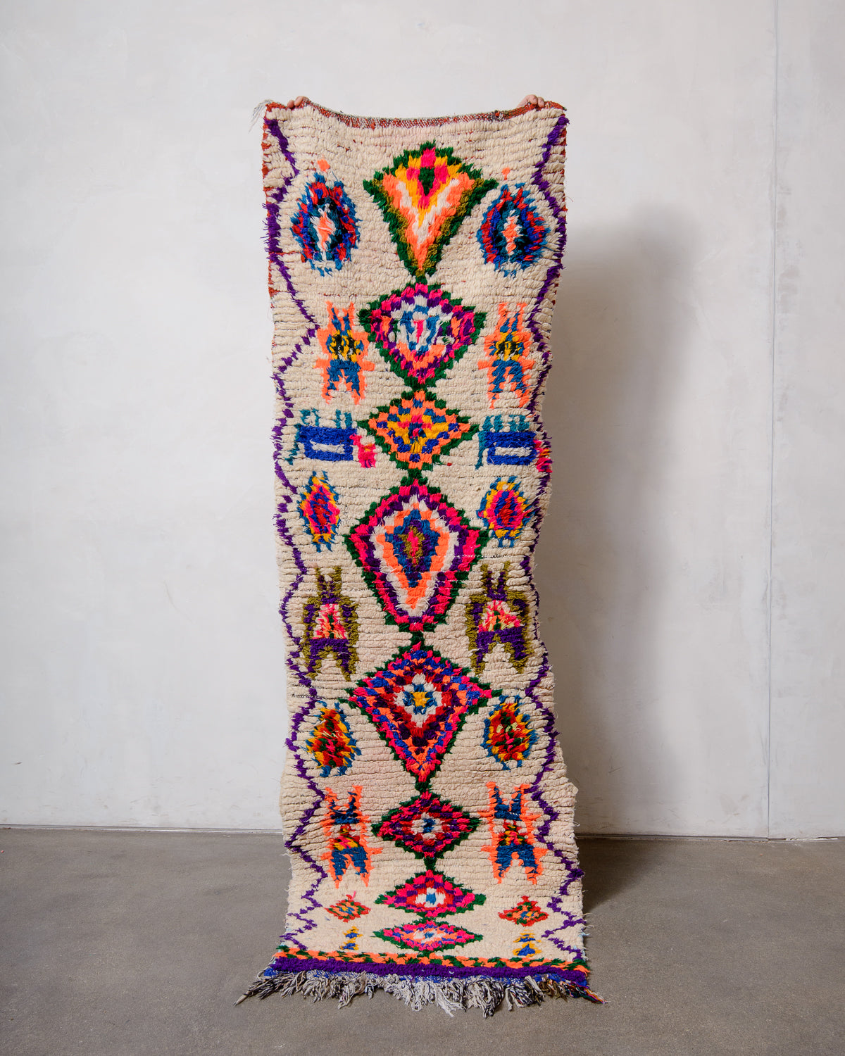 Modern designer vintage handcrafted Berber rug from Morocco. Boucherouite runner rug with beautiful colors and patterns.