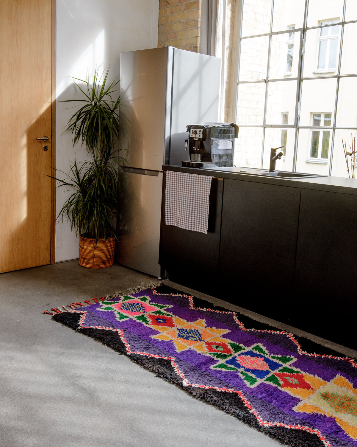 Modern designer vintage handcrafted Berber rug from Morocco. Boucherouite with beautiful colors and patterns.