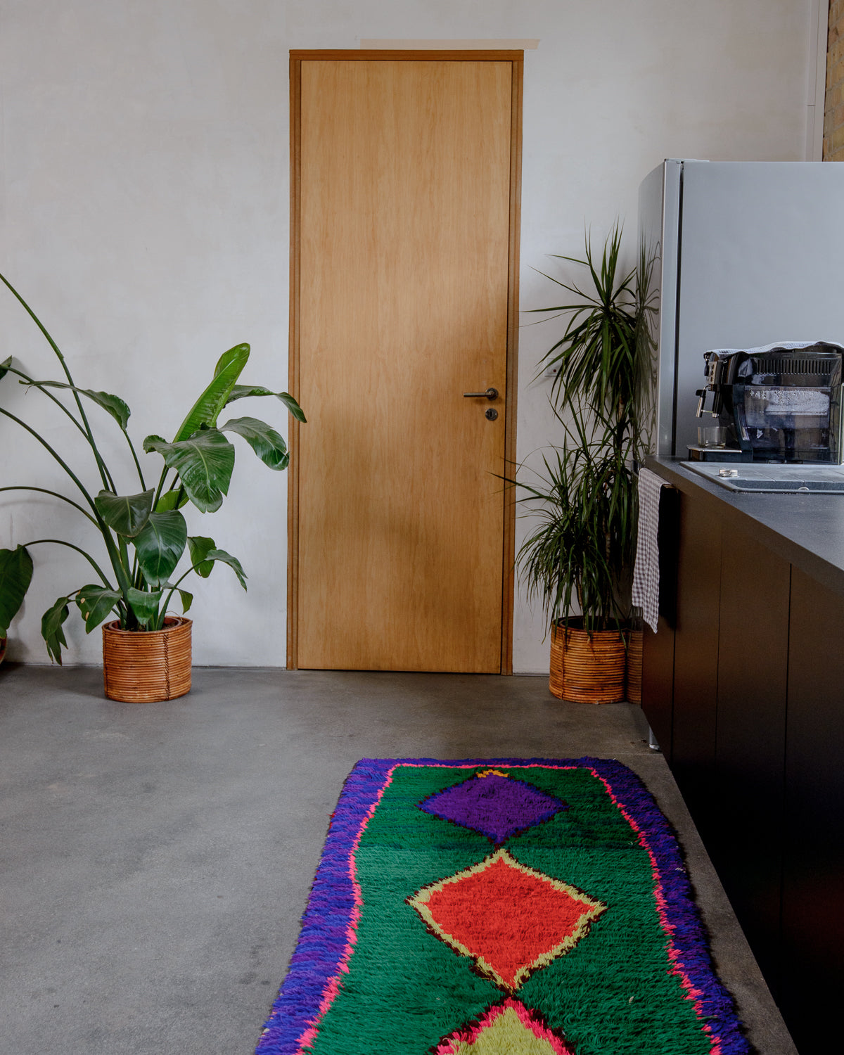 Modern designer vintage handcrafted Berber rug from Morocco. Boucherouite with beautiful colors and patterns.