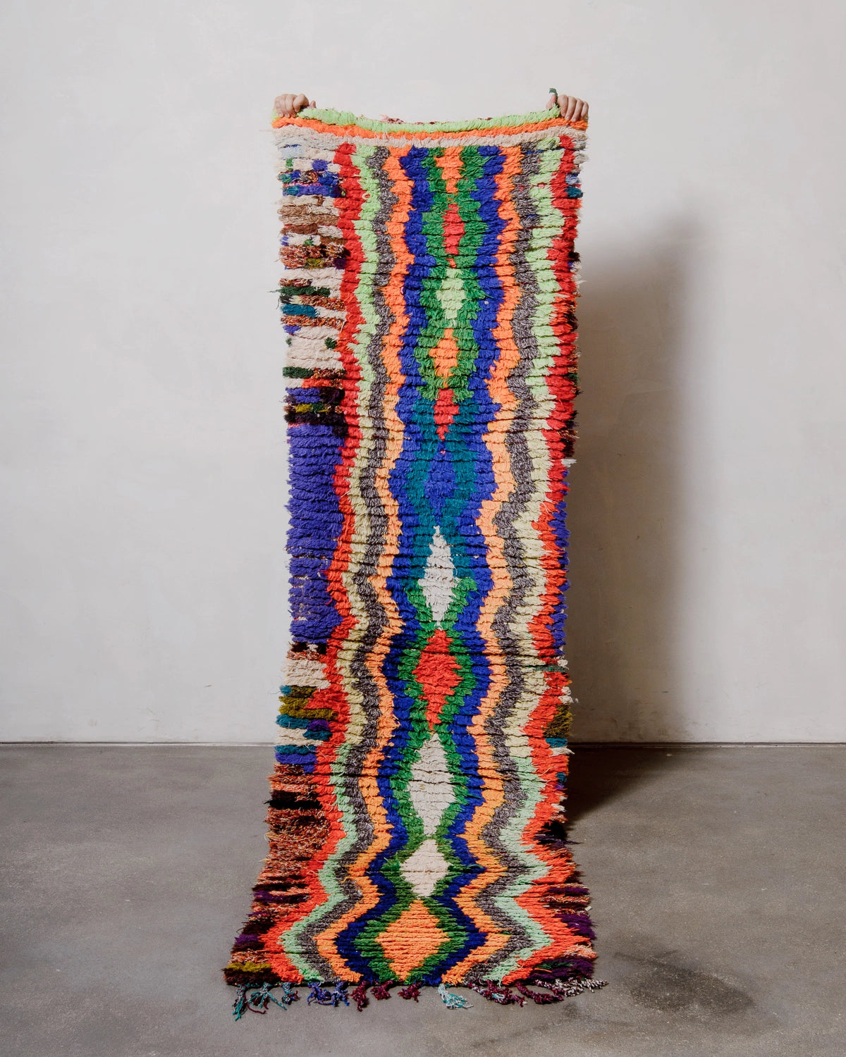 Berberlin Vintage Runner Rug made of recycled cloth and yarn in bright colours including blue, green, red and orange.