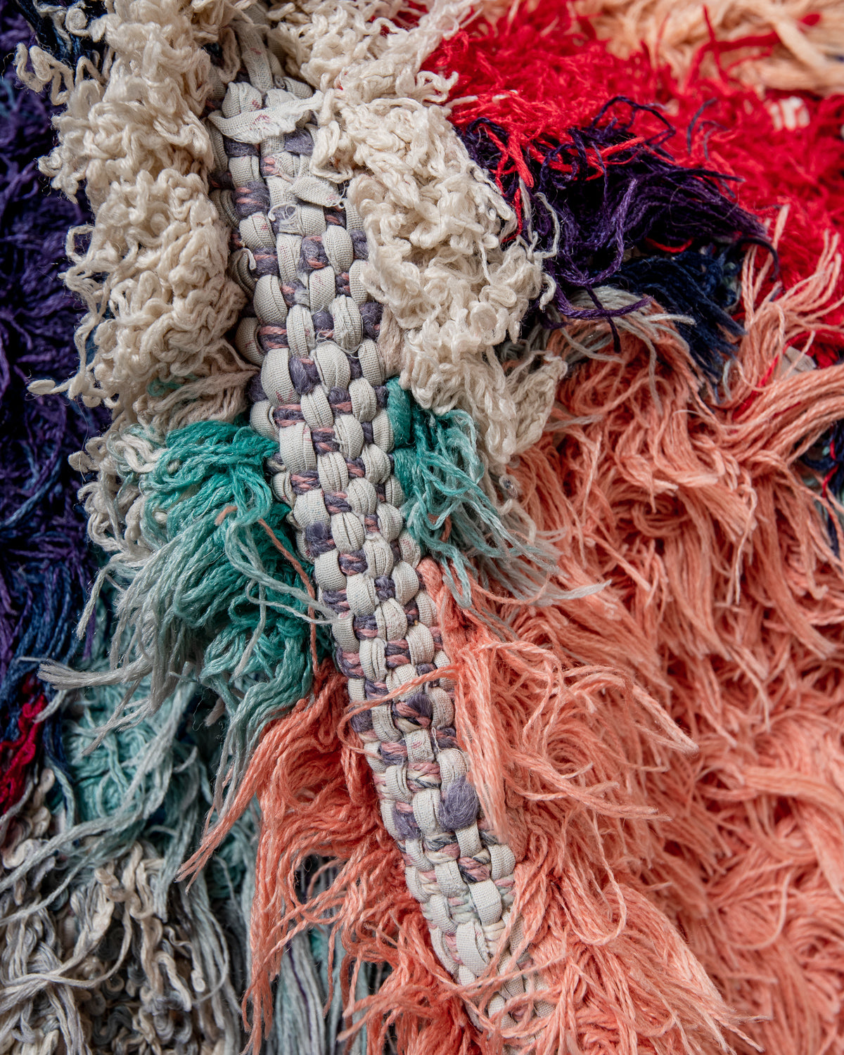 Modern designer vintage handcrafted Berber rug from Morocco. Boucherouite with beautiful colors and patterns.