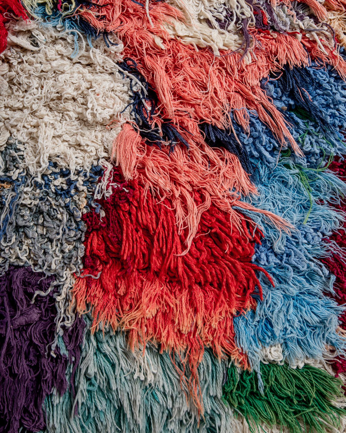 Modern designer vintage handcrafted Berber rug from Morocco. Boucherouite with beautiful colors and patterns.