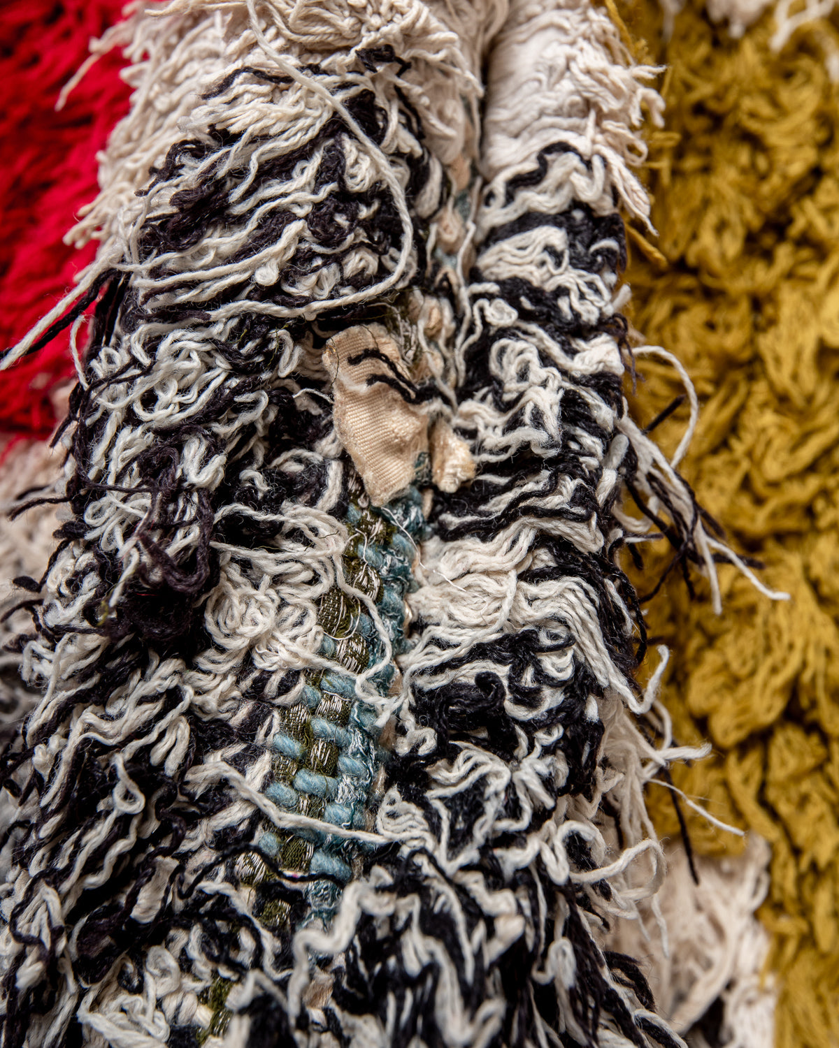 Modern designer vintage handcrafted Berber rug from Morocco. Boucherouite runner rug with beautiful colors and patterns.