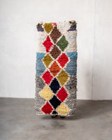 Modern designer vintage handcrafted Berber rug from Morocco. Boucherouite runner rug with beautiful colors and patterns.
