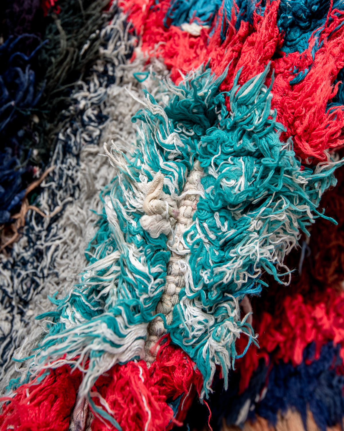 Modern designer vintage handcrafted Berber rug from Morocco. Boucherouite runner rug with beautiful colors and patterns.