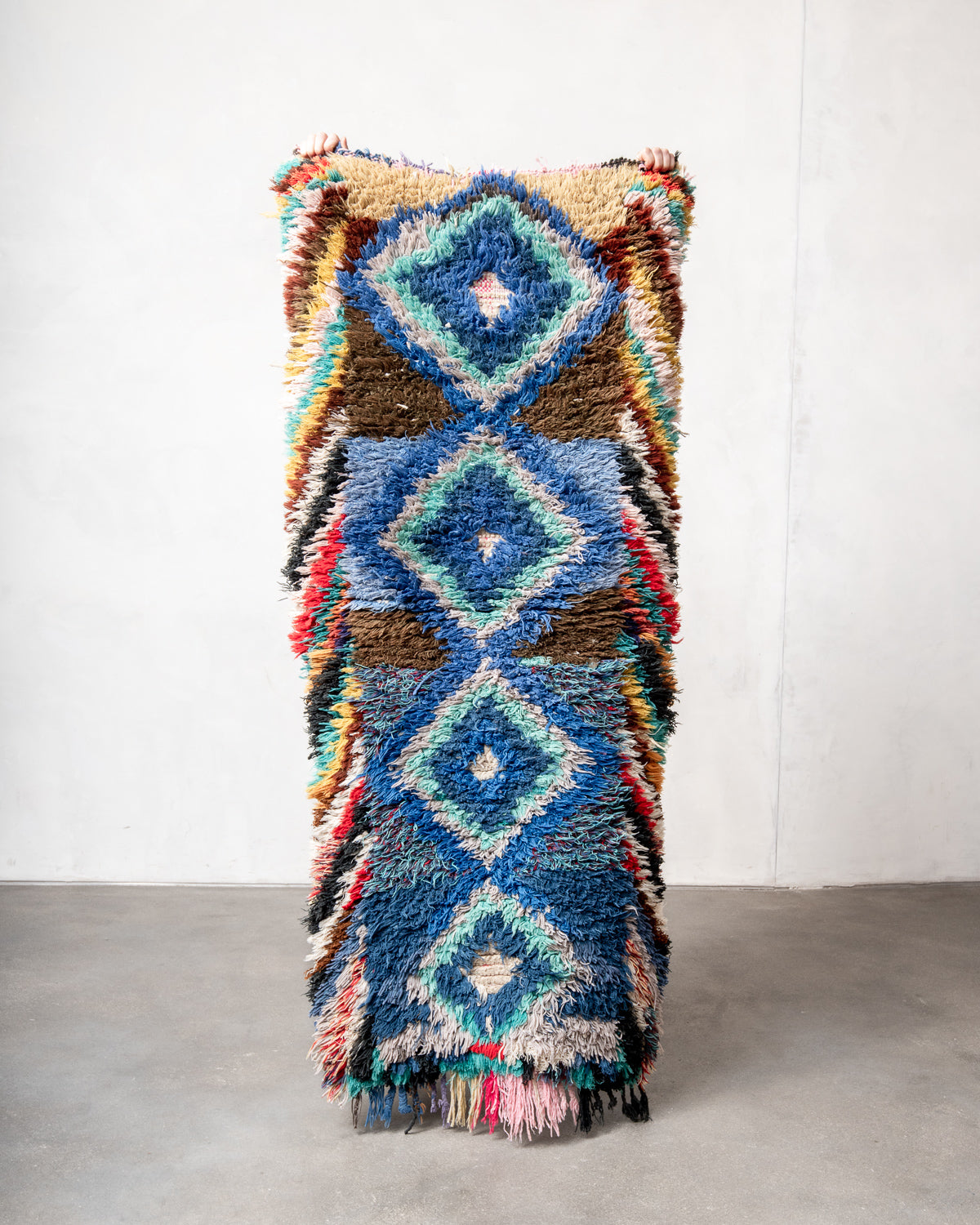 Modern designer vintage handcrafted Berber rug from Morocco. Boucherouite runner rug with beautiful colors and patterns.