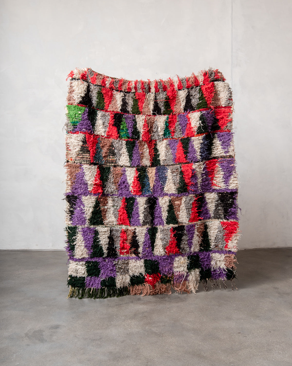 Modern designer vintage handcrafted Berber rug from Morocco. Boucherouite with beautiful colors and patterns.