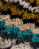 Modern designer vintage handcrafted Berber rug from Morocco. Boucherouite runner rug with beautiful colors and patterns.