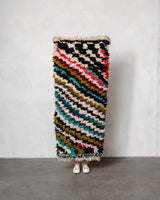 Modern designer vintage handcrafted Berber rug from Morocco. Boucherouite runner rug with beautiful colors and patterns.
