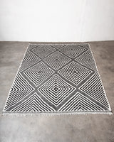 Modern, handcrafted Berber rug from Morocco. Flat-woven Kelim carpet in black and white design. Made of 100% wool.