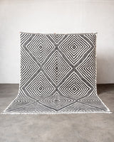 Modern, handcrafted Berber rug from Morocco. Flat-woven Kelim carpet in black and white design. Made of 100% wool.