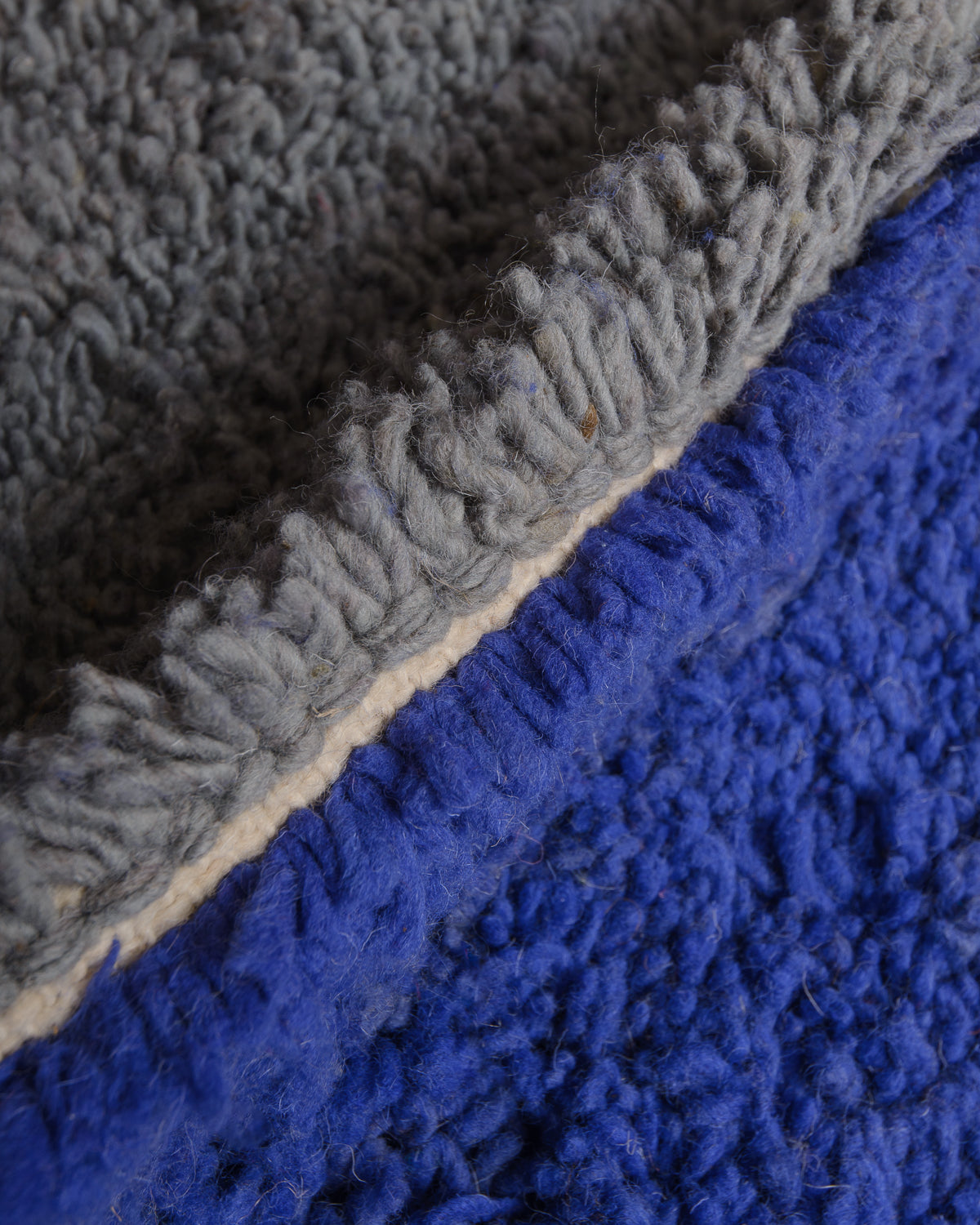 Close up of wool rug with colourful details. 