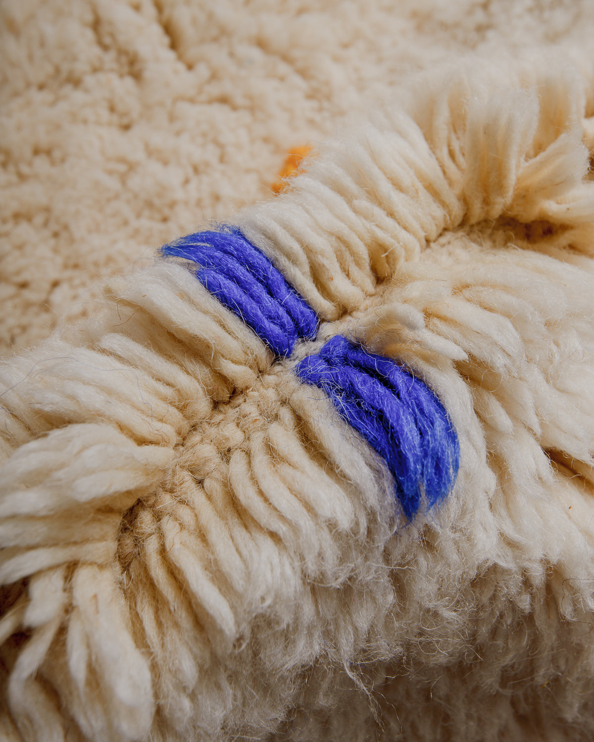 Close up of rug showing plush wool pile.