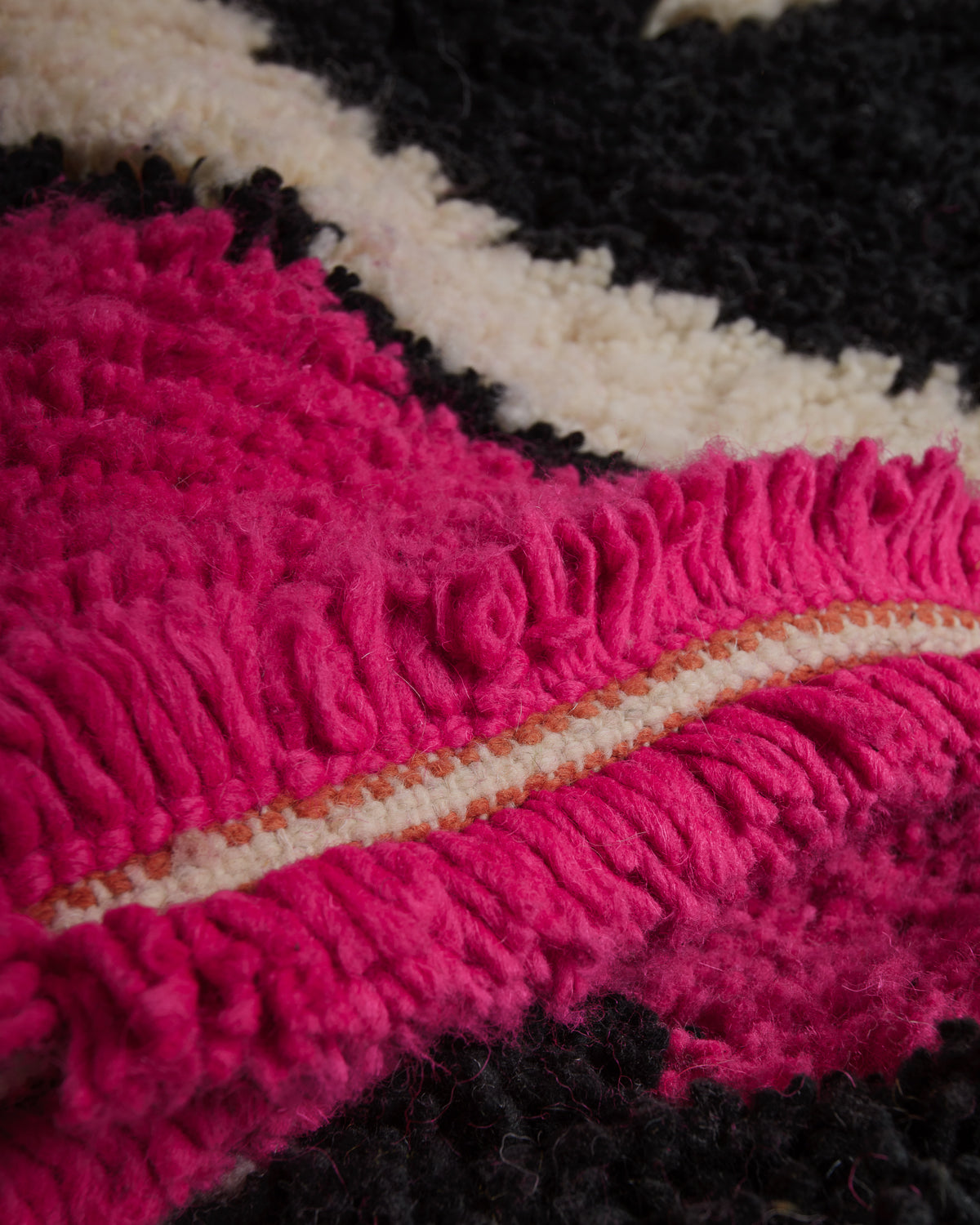 Close up of vintage boujaad rug showing length of pile and texture.