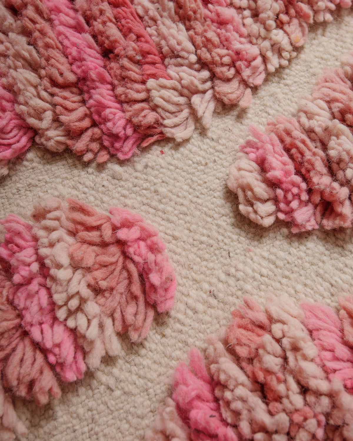 Close up of vintage boujaad rug showing length of pile and texture of woven areas.
