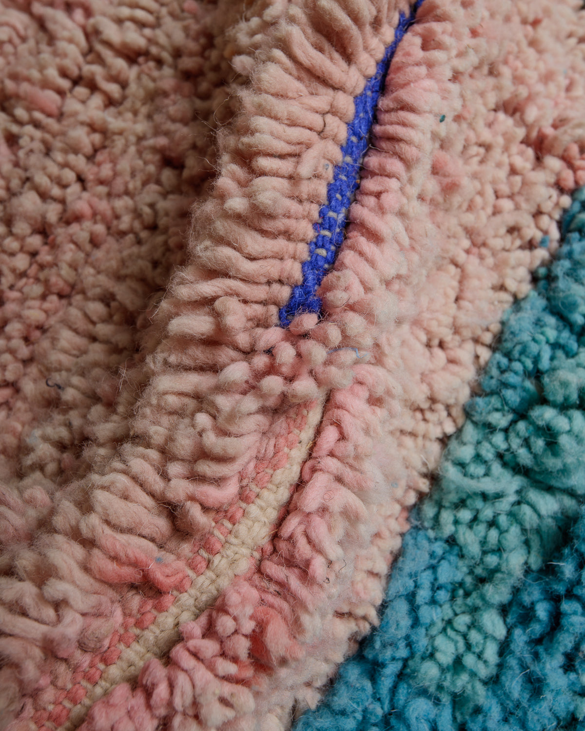 Close up of vintage boujaad rug showing length of pile and texture.