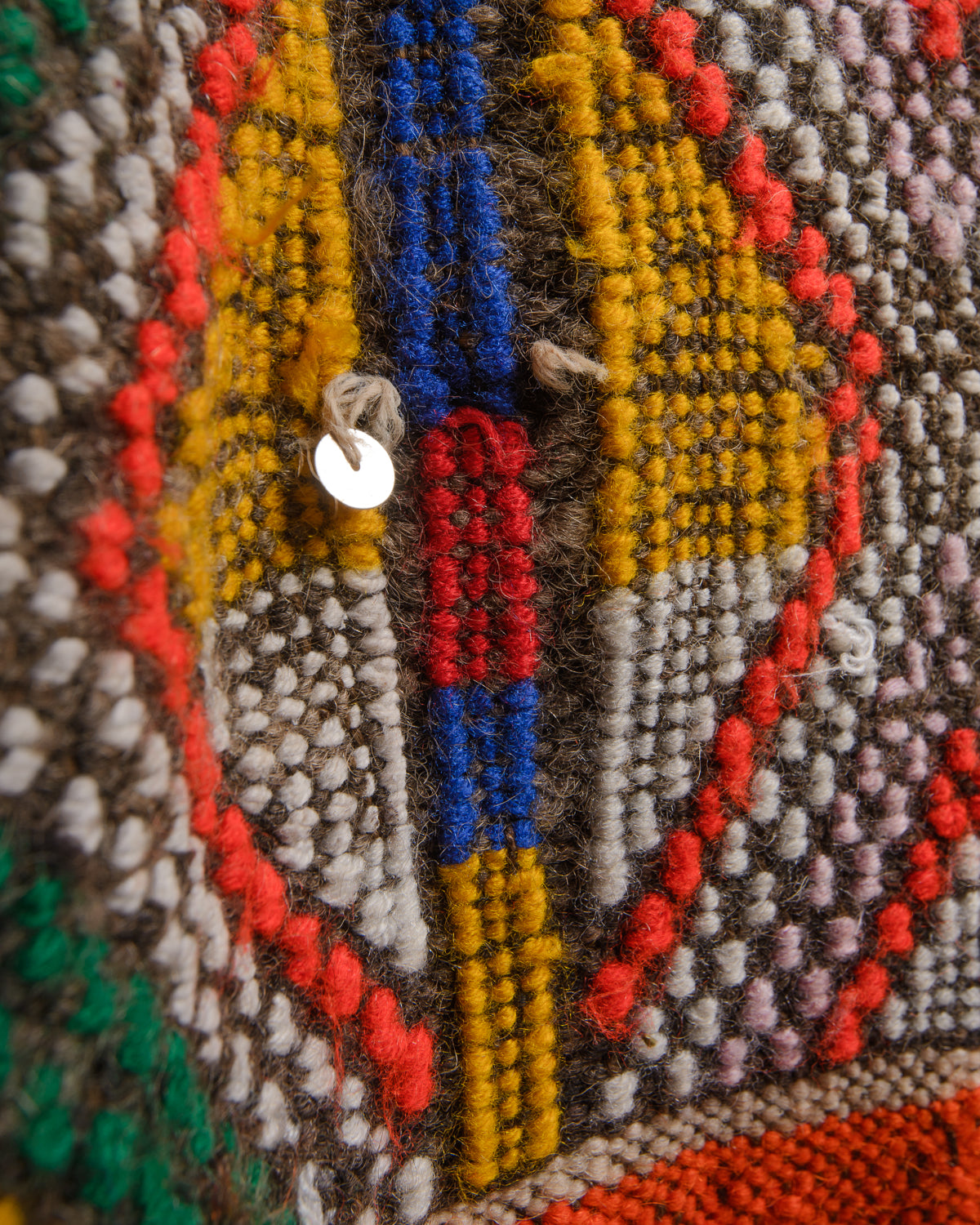 Surface details of colourful vintage kelim rug.