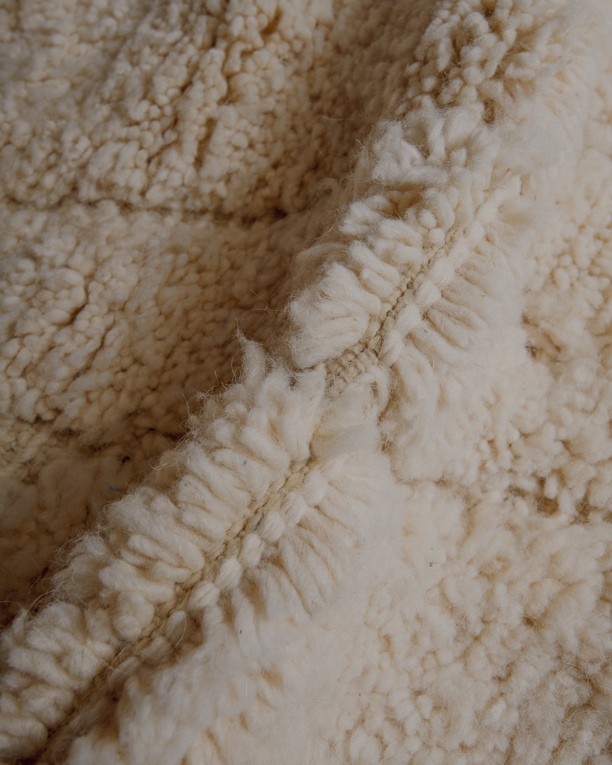 Fluffy cream wool pile.