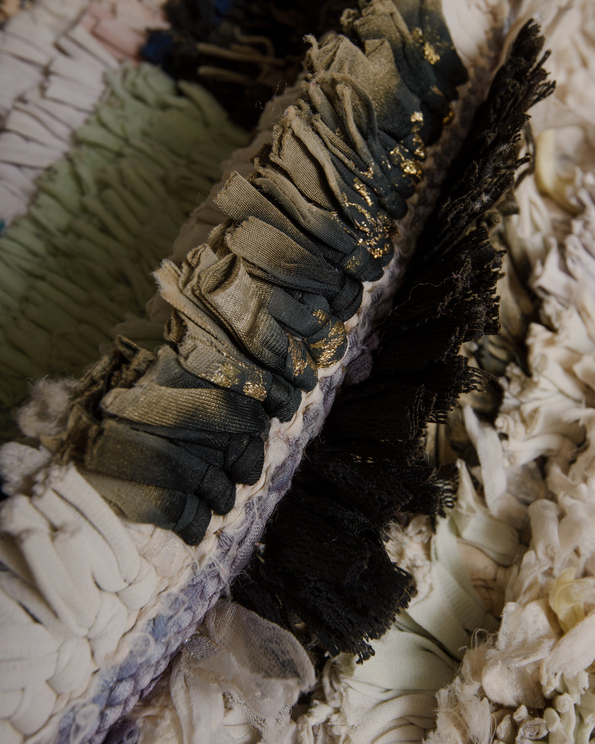 Close up of boucherouite rug made of recycled fabric remnants.